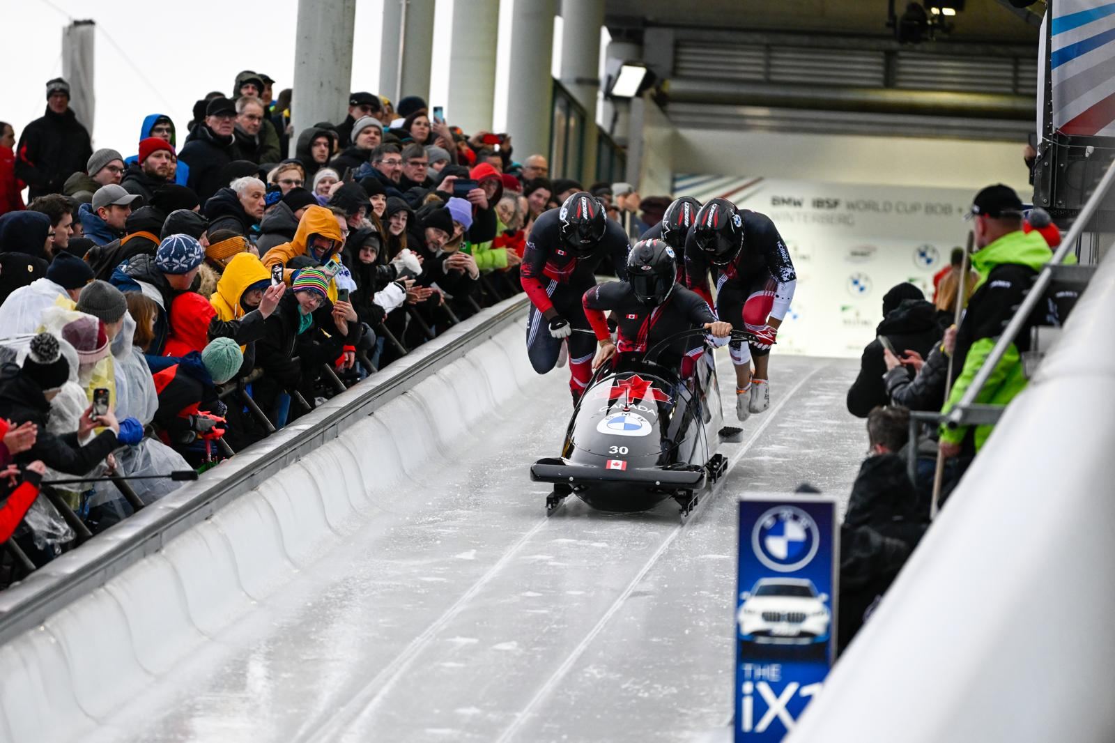 Team Canada push start at a World Cup race in front of the crowd