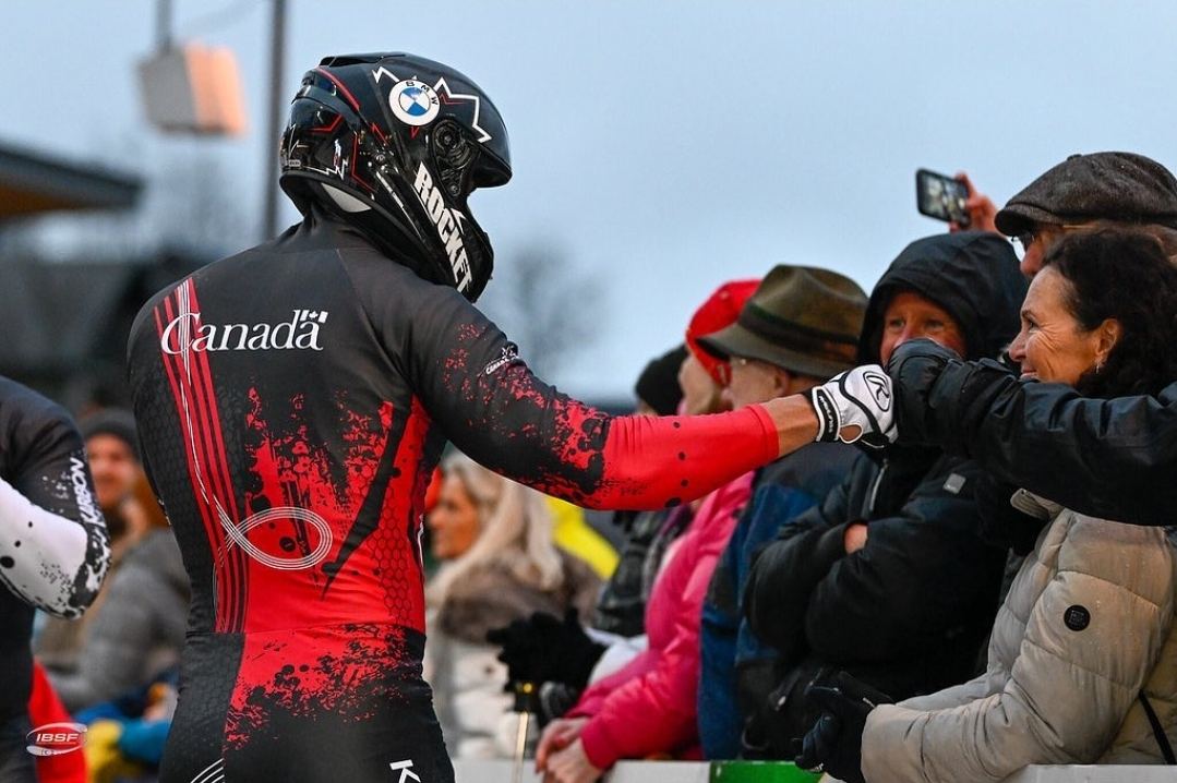 Athlete greeting spectators after competition
